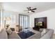 Spacious living room featuring a ceiling fan and sliding glass doors at 41703 W Mesquite Rd, Maricopa, AZ 85138