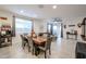 Bright dining room with a wood table and seating for six at 4524 S 127Th Ln, Avondale, AZ 85323