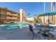 Relaxing community pool area with tables and umbrellas at 4950 N Miller Rd # 347, Scottsdale, AZ 85251