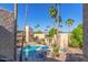 Community pool and spa with surrounding patio furniture at 4950 N Miller Rd # 347, Scottsdale, AZ 85251