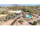 Aerial view of single-story home with pool, desert landscaping, and mountain views at 4979 E Calle De Los Arboles --, Cave Creek, AZ 85331