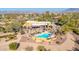 Aerial view of single-story home with pool, desert landscaping, and mountain views at 4979 E Calle De Los Arboles --, Cave Creek, AZ 85331