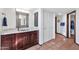 Bathroom with dark wood vanity, tile floor, and walk-in closet at 4979 E Calle De Los Arboles --, Cave Creek, AZ 85331