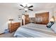 Spacious bedroom with large closet, ceiling fan, and wood dresser at 4979 E Calle De Los Arboles --, Cave Creek, AZ 85331