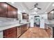 Modern kitchen with dark wood cabinets and granite countertops at 4979 E Calle De Los Arboles --, Cave Creek, AZ 85331