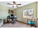 Bright home office with large window, desk, and ceiling fan at 4979 E Calle De Los Arboles --, Cave Creek, AZ 85331