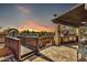 Outdoor kitchen and patio area with pergola and bridge at 4979 E Calle De Los Arboles --, Cave Creek, AZ 85331