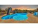 Refreshing pool with slide, chairs, and sunset view at 4979 E Calle De Los Arboles --, Cave Creek, AZ 85331