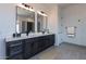 Elegant bathroom with dual vanities and dark wood cabinets at 508 W Tanya Rd, Phoenix, AZ 85086