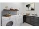 Well-equipped laundry room, featuring washer, dryer, and cabinets at 508 W Tanya Rd, Phoenix, AZ 85086