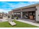 Covered patio with outdoor kitchen and seating at 5645 N Crow Dr, Eloy, AZ 85131