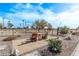 Landscaped backyard with seating area and golf course view at 5645 N Crow Dr, Eloy, AZ 85131