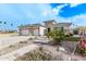 Single-story home with two-car garage, stone accents, and landscaped front yard at 5645 N Crow Dr, Eloy, AZ 85131