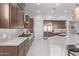 Modern kitchen with stainless steel appliances and white cabinets at 5645 N Crow Dr, Eloy, AZ 85131