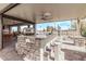 Outdoor bar with granite countertop and seating for multiple guests at 5645 N Crow Dr, Eloy, AZ 85131