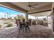 Outdoor kitchen with built-in grill, stone counters, and seating at 5645 N Crow Dr, Eloy, AZ 85131