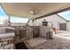 Outdoor kitchen with stonework, granite counters, and pizza oven at 5645 N Crow Dr, Eloy, AZ 85131