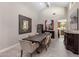 Modern dining room with large table and kitchen view at 5660 N 73Rd St, Scottsdale, AZ 85250