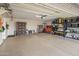 Large garage with ample storage and overhead shelving at 5660 N 73Rd St, Scottsdale, AZ 85250