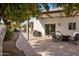 Outdoor patio with fire pit and seating under citrus trees at 5660 N 73Rd St, Scottsdale, AZ 85250