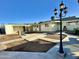 Spacious backyard with a large lamp post and a detached structure at 5708 W Belmont Ave, Glendale, AZ 85301