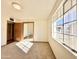 Bedroom with mirrored closet doors and a large window at 5708 W Belmont Ave, Glendale, AZ 85301