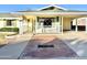 Ranch-style home with covered porch and brick walkway at 5708 W Belmont Ave, Glendale, AZ 85301