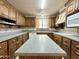 Kitchen with dark wood cabinets and granite countertops at 5708 W Belmont Ave, Glendale, AZ 85301