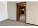 Open doorway reveals built-in shelves and adjacent room at 5708 W Belmont Ave, Glendale, AZ 85301