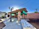 Brick patio with pergola, seating, and mosaic tile accents at 5708 W Belmont Ave, Glendale, AZ 85301