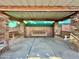 Covered patio with brick columns and hanging swings at 5708 W Belmont Ave, Glendale, AZ 85301