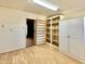 Bright storage room with ample shelving and light flooring at 5708 W Belmont Ave, Glendale, AZ 85301