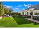 Expansive backyard with a grassy lawn, pool, and patio area at 6602 E Lafayette Blvd, Scottsdale, AZ 85251