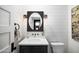 Contemporary powder room with shiplap walls and floating vanity at 6602 E Lafayette Blvd, Scottsdale, AZ 85251