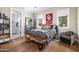 Cozy bedroom with hardwood floors and built-in shelving at 6602 E Lafayette Blvd, Scottsdale, AZ 85251