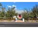 Street view of charming white home with red door and manicured lawn at 6602 E Lafayette Blvd, Scottsdale, AZ 85251