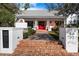 Pathway to a white brick home with a red front door at 6602 E Lafayette Blvd, Scottsdale, AZ 85251