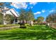 Landscaped front yard with lush grass and manicured hedges at 6602 E Lafayette Blvd, Scottsdale, AZ 85251