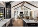 Open concept kitchen with island, white countertops, and dark cabinetry at 6602 E Lafayette Blvd, Scottsdale, AZ 85251