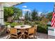 Outdoor patio furniture on a porch with a view of the street at 6602 E Lafayette Blvd, Scottsdale, AZ 85251