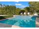 Relaxing pool with a waterfall feature and lounge chairs at 6602 E Lafayette Blvd, Scottsdale, AZ 85251