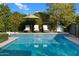 Refreshing pool with waterfall feature and lounge chairs at 6602 E Lafayette Blvd, Scottsdale, AZ 85251