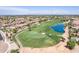 Aerial perspective of homes near a golf course and a water feature at 6616 S Bridal Vail Dr, Gilbert, AZ 85298