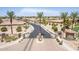 Community entrance with guard gate and surrounding homes, golf course, and mountains at 6616 S Bridal Vail Dr, Gilbert, AZ 85298