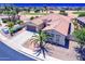 Beautiful aerial view of a single-Gathering home on a golf course with desert landscaping at 6616 S Bridal Vail Dr, Gilbert, AZ 85298