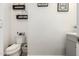 Small half bathroom with toilet and vanity at 6616 S Bridal Vail Dr, Gilbert, AZ 85298