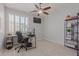 Home office in bedroom with desk and shelving at 6616 S Bridal Vail Dr, Gilbert, AZ 85298