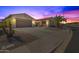 Two-story house with a large driveway and desert landscaping at 6616 S Bridal Vail Dr, Gilbert, AZ 85298