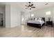 Bright main bedroom with ceiling fan and large windows at 6616 S Bridal Vail Dr, Gilbert, AZ 85298