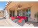 Covered patio with seating area and ceiling fan at 6616 S Bridal Vail Dr, Gilbert, AZ 85298